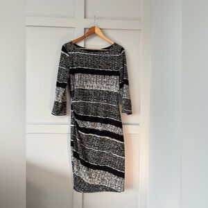 Elegant Black and White Striped Midi Dress With Flattering Ruched Side